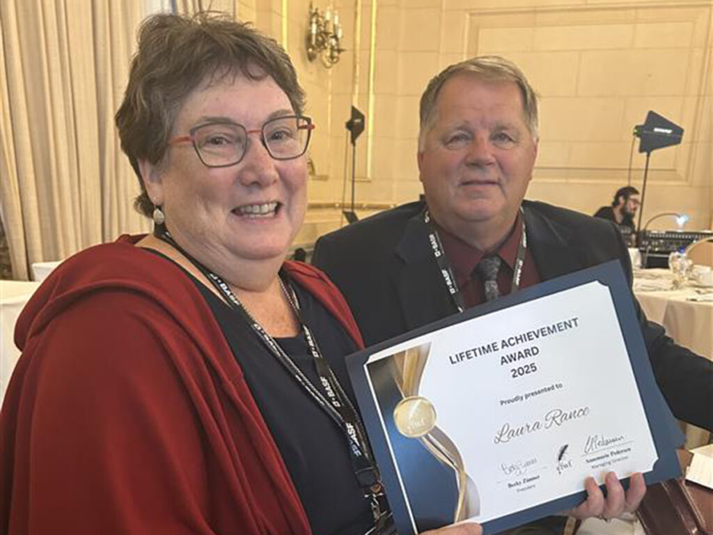 Glacier FarmMedia executive editor Laura Rance displays her Canadian Farm Writers Federation Lifetime Achievement Award.