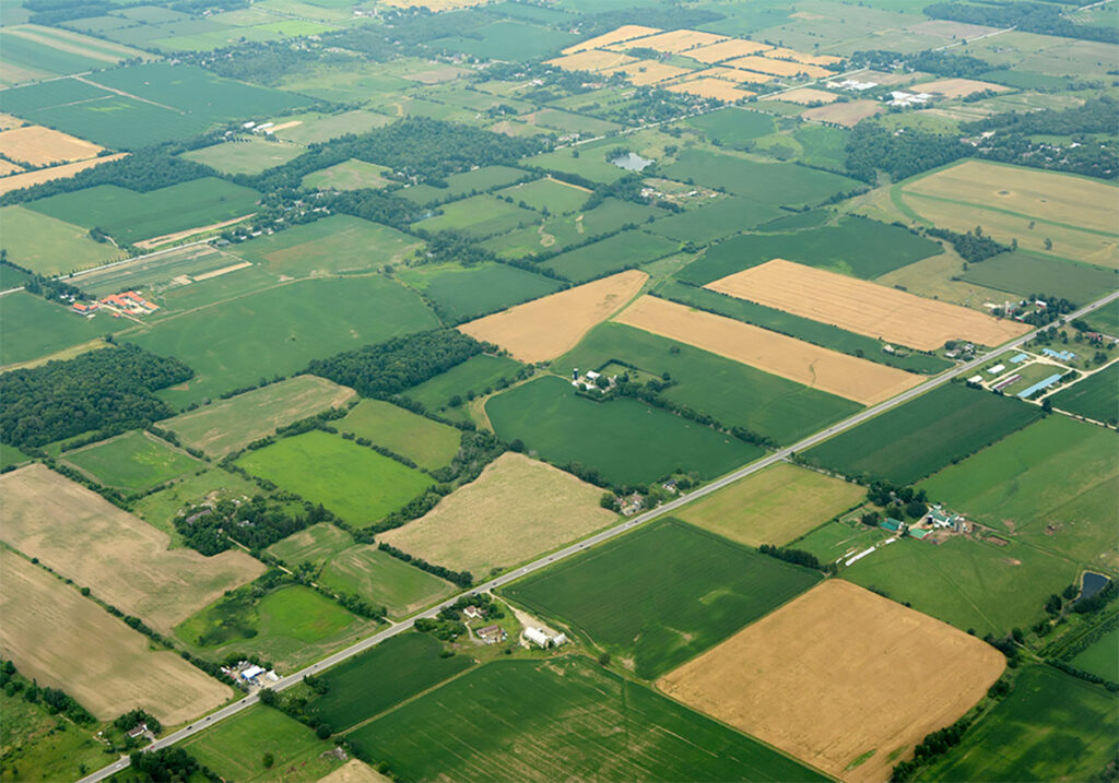 An aerial photo highlighting the checkerboard-like nature of farmland when seen from high above.