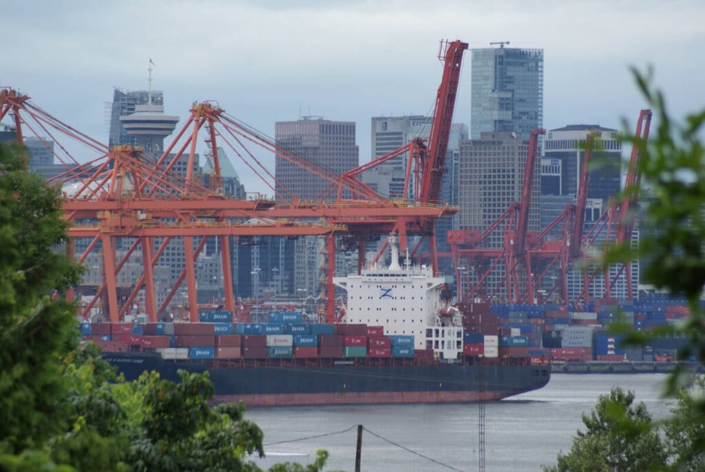 A bulk grain ship in the Port of Vancouver passes in front of the Cargill export terminal.