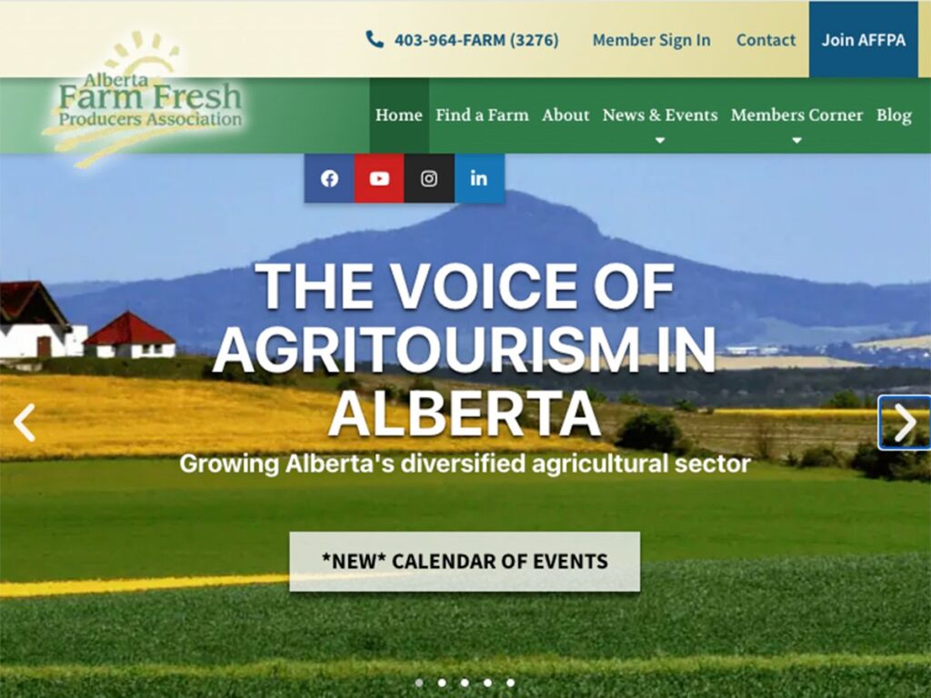 A screencap from the homepage of the Alberta Farm Fresh Producers Association showing a rural setting in the summer with the foothills in the background and the words, 