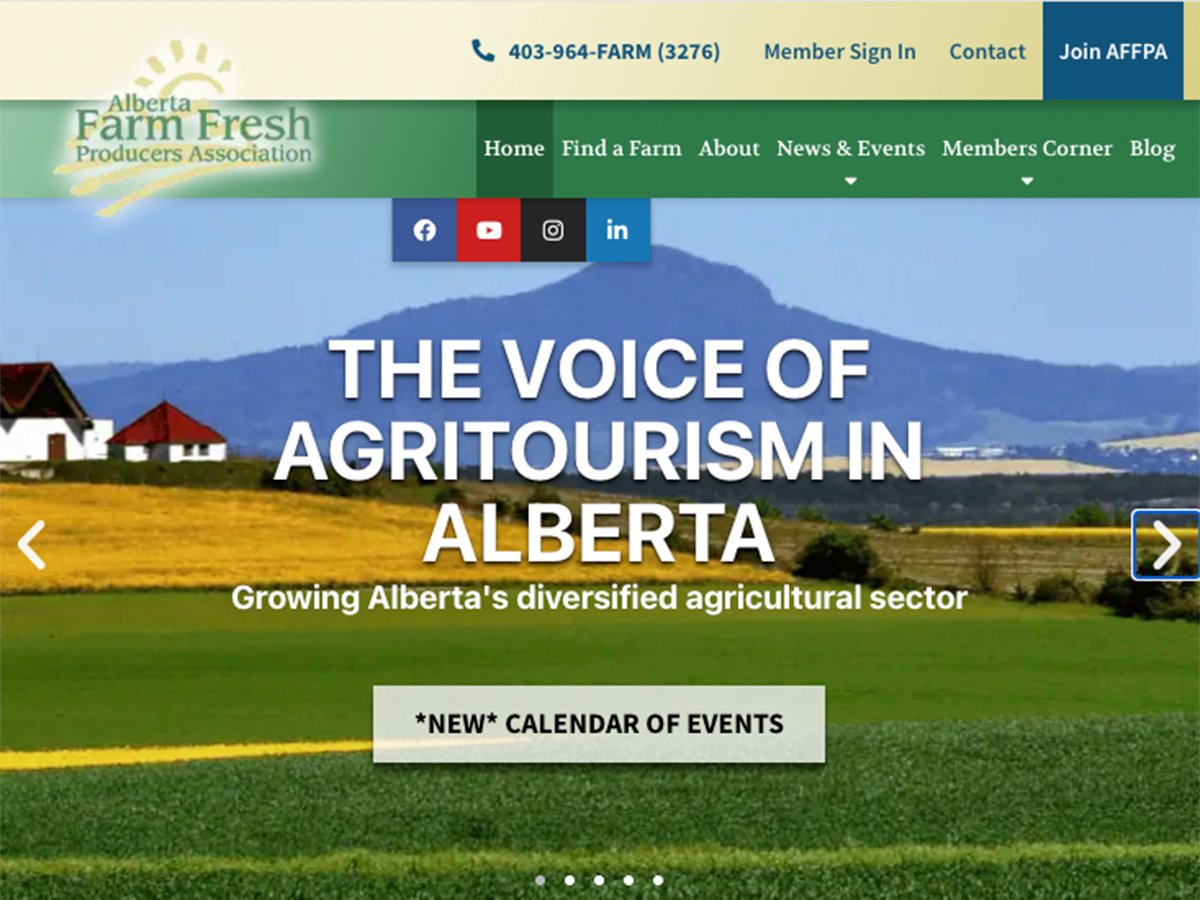 A screencap from the homepage of the Alberta Farm Fresh Producers Association showing a rural setting in the summer with the foothills in the background and the words, 
