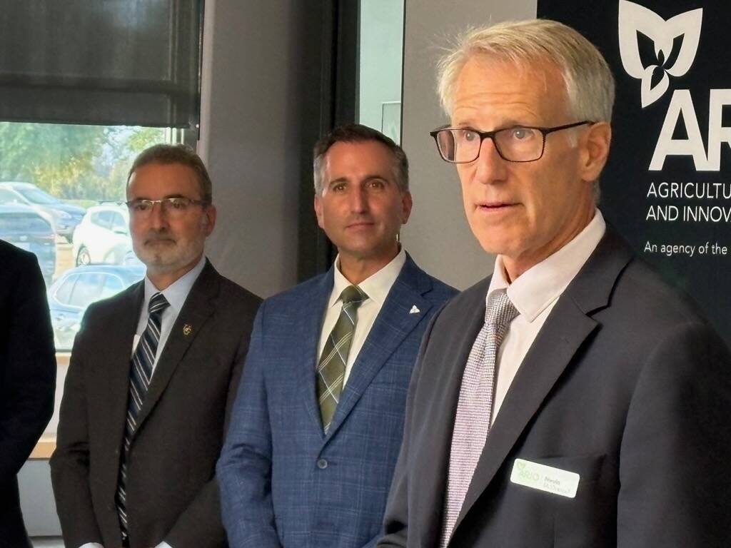 Nevin McDougall, left, of ARIO, listens at the OMAFA announcement of new funding for ARIO on Oct. 7. Also shown are Trevor Jones, Ontario