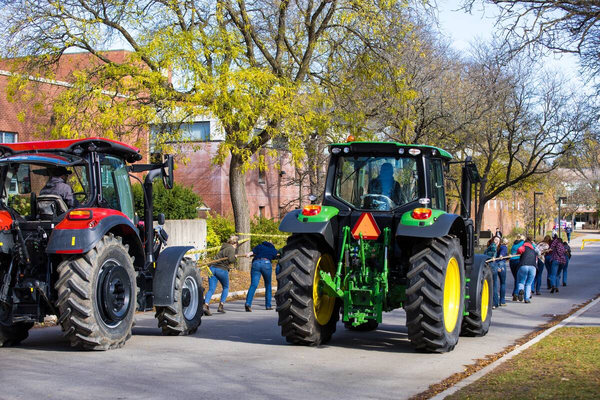 Teams competing in the tractor pull at Tractor Tug for Tots.