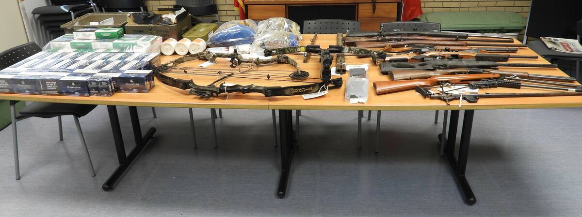 Firearms, ammunition and other items seized by police from a property in Zhoda, in Manitoba's rural southeast on Oct. 28, 2025. Photo: RCMP