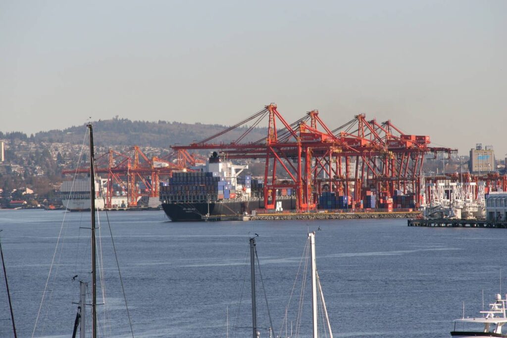 Looking across the harbour at a container ship moored at the Port of Vancouver.