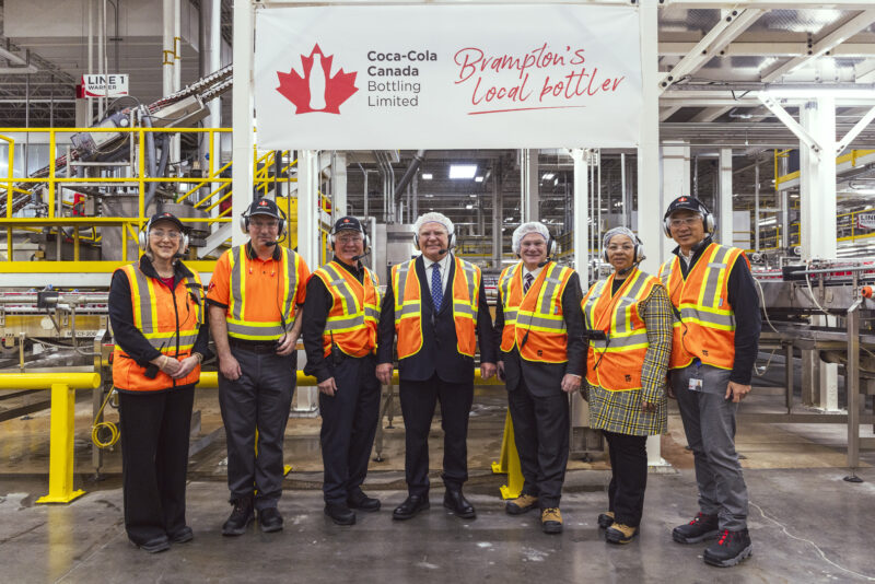 Tara Hayward, general manager, Brampton; James McKechnie, director of manufacturing, Coke Canada Bottling; Todd Parsons, CEO, Coke Canada Bottling; Premier Doug Ford; Todd J. McCarthy, Minister of the Environment, Conservation and Parks; Charmaine A. Williams, Associate Minister of Women's Social and Economic Opportunity; and Tony Chow, president, Coke Canada Bottling.