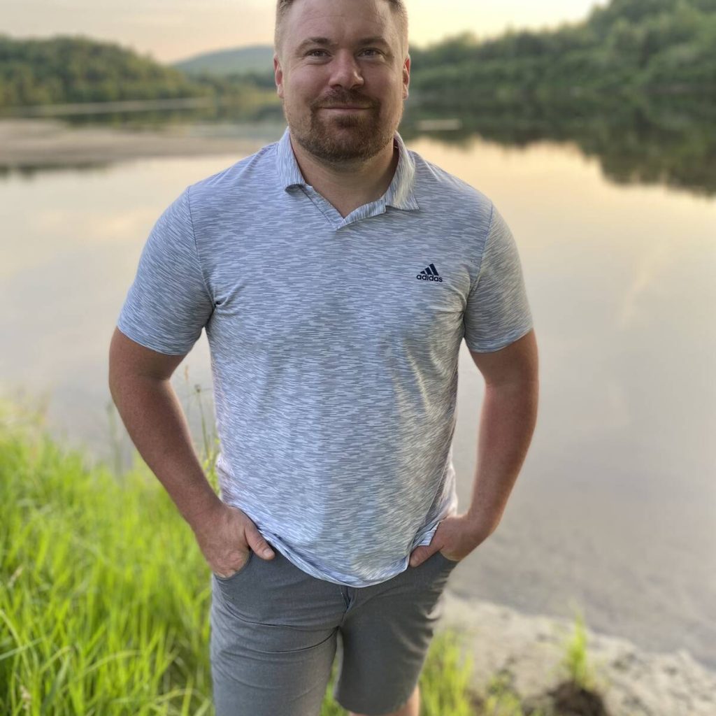 Quebec farmer Maxime Leduc standing in front of a river. Photo: Lilian Schaer
