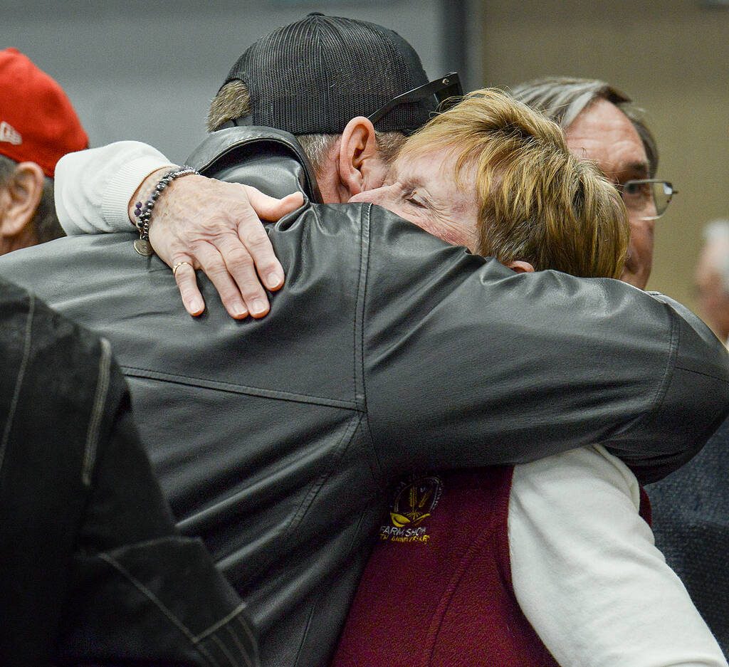 Kathy Hardy, left, winnder of the 2026 Ottawa Valley Seed Growers Association's Award of Excellence, is congratulated by family and friends after the presentation March 11 at the Ottawa Valley Farm Show. Photo: Diana Martin