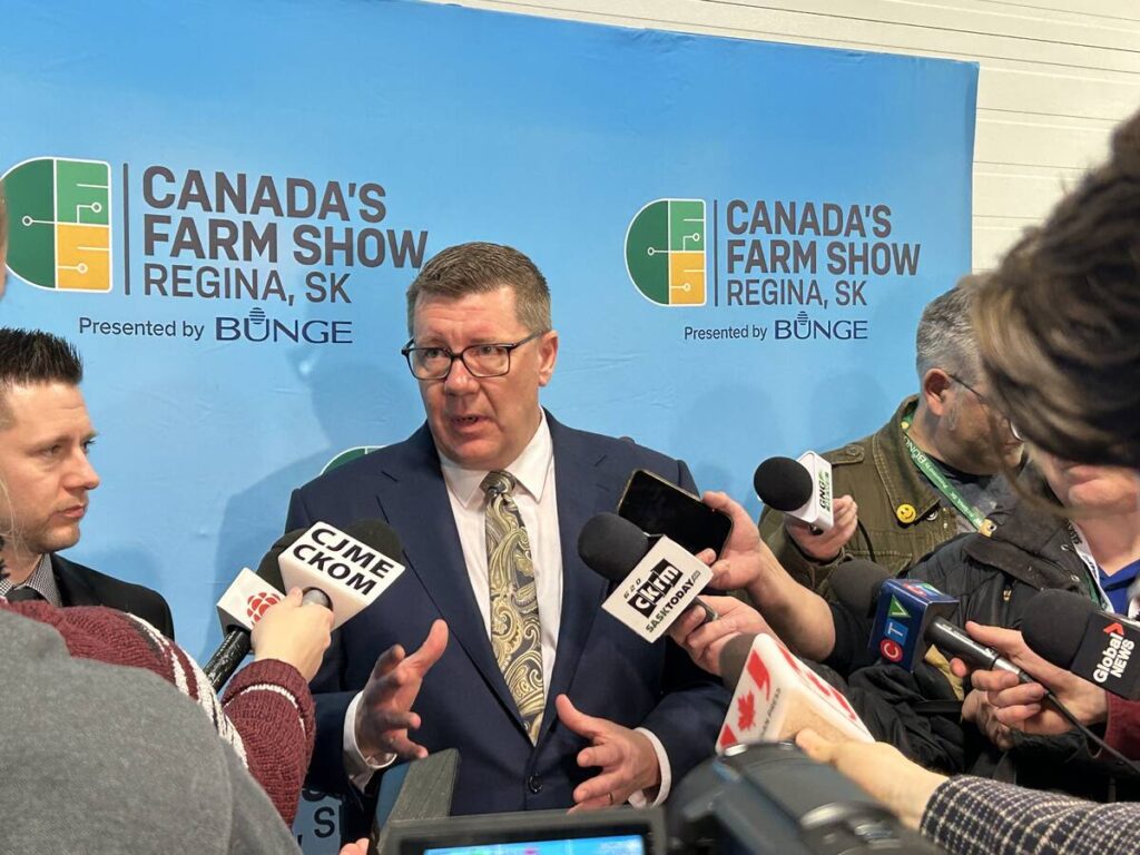 Premier Scott Moe speaks to reporters after opening Canada