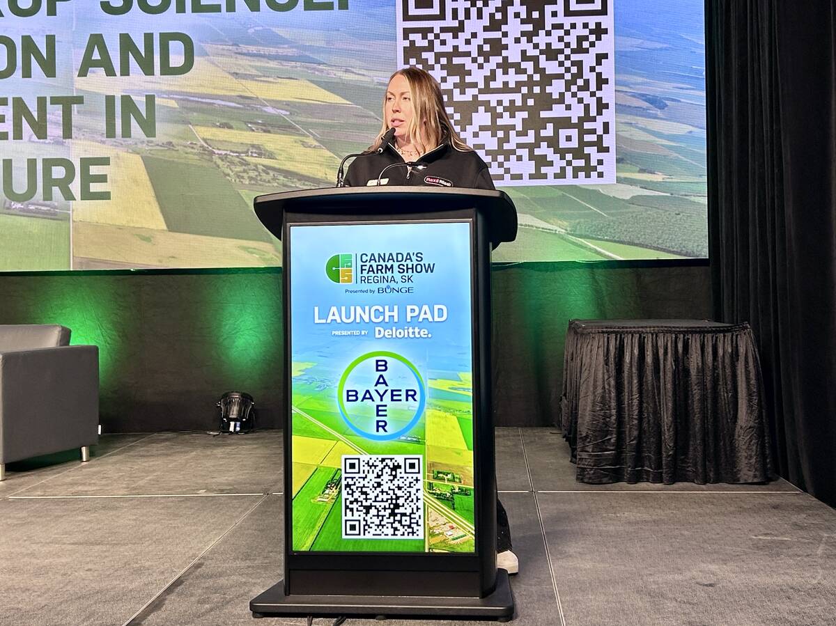 Jimmi-Lee Jackson from Bayer speaks to new products at Canada's Farm Show 2026. Photo: Janelle Rudolph
