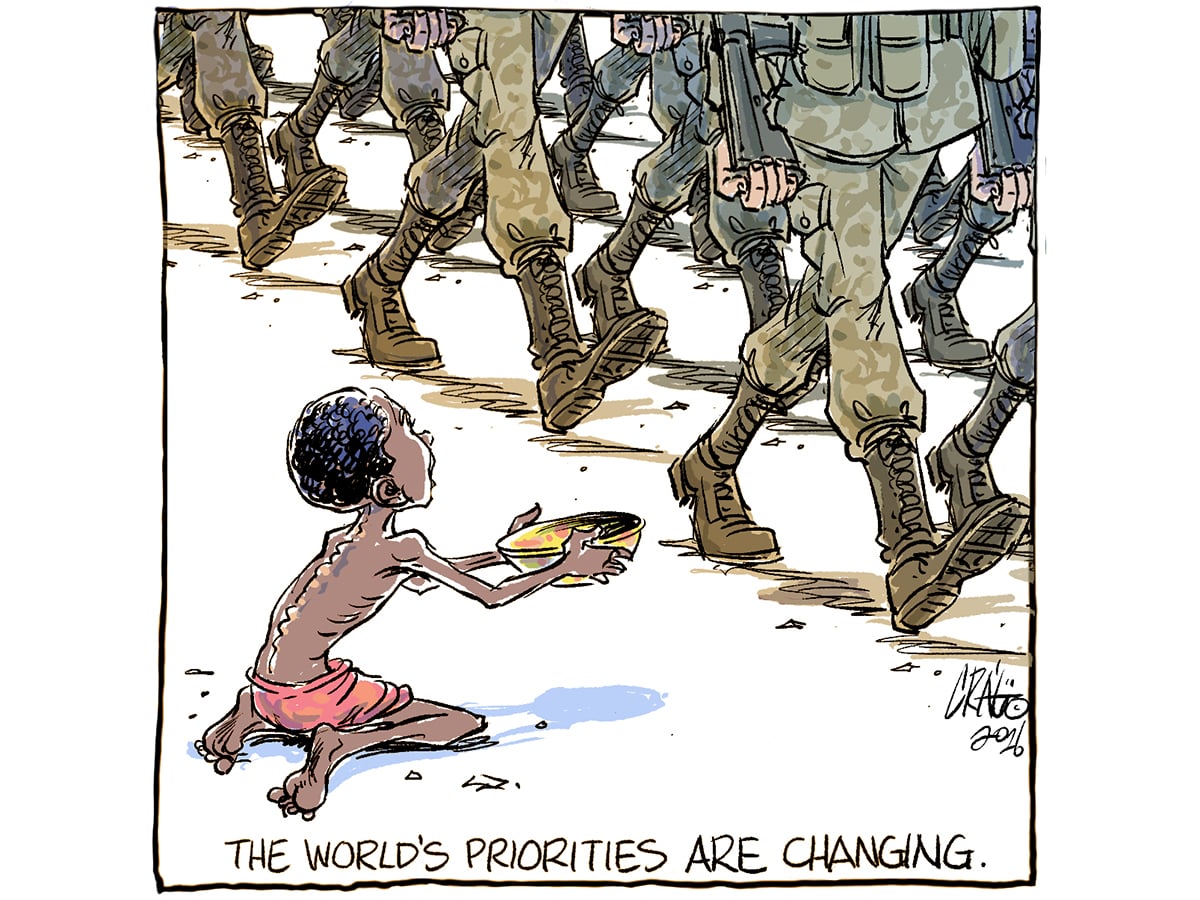 An editorial cartoon showing a child on his knees holding an empty bowl out as just the legs and boots of soldiers are visible as they march by.