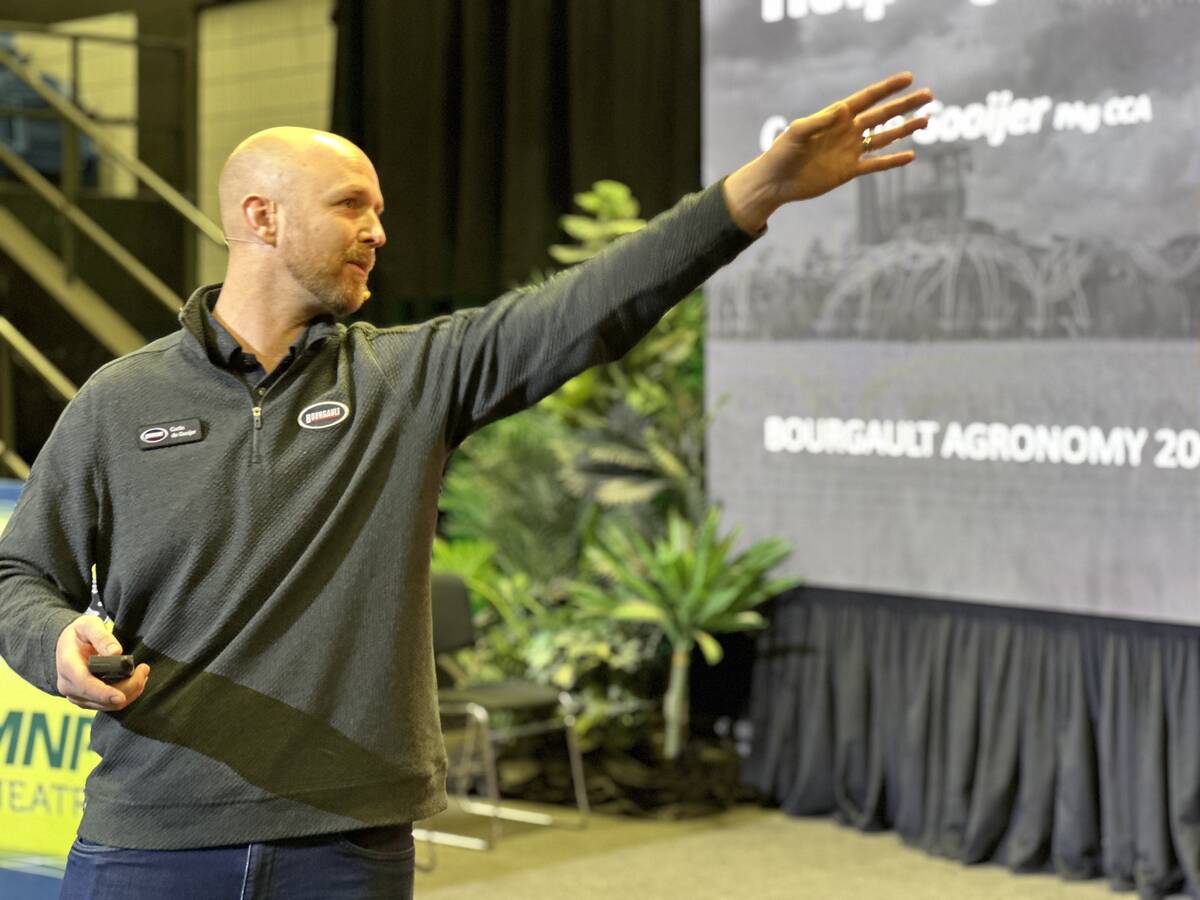 A bald man holding a 