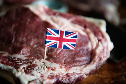 Great British Beef steak with a Union Jack Flag sticking out of the meat.