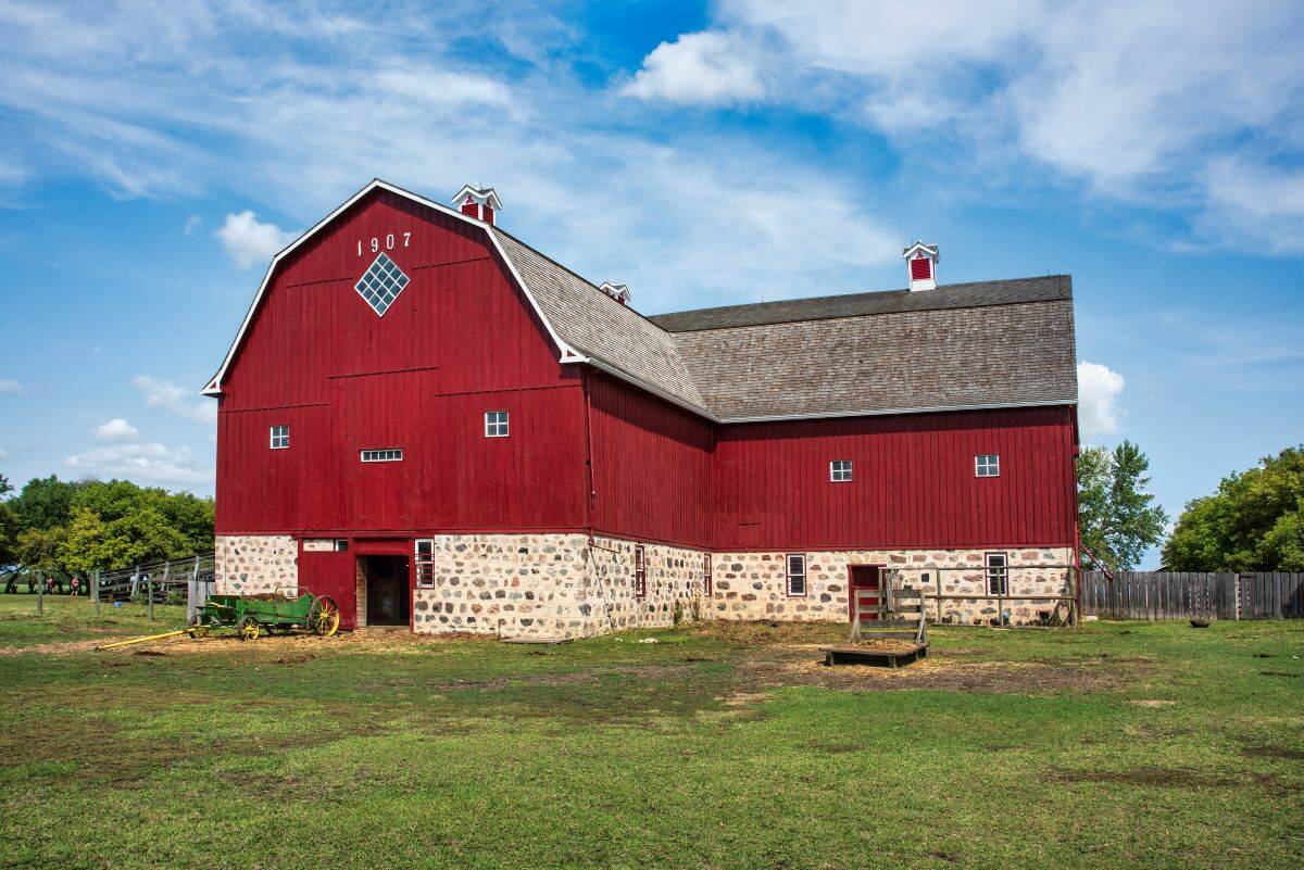An old red barn with the date 1907 on it at the Motherwell Homestead near Abernethy, Saskatchewan, Canada. 