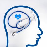 A graphic outline of a human head with a heart for a brain and a stethoscope to denote well-being and/or mental health.