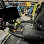 The cab of a New Holland combine displays a sophisticated set up of screens and control options, highlighting the advancing technology becoming more standard in today's farm operations. Photo: Alexis Stockford
