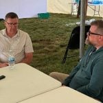 Scott Moe, left, talks to Western Producer reporter Sean Pratt at the Ag in Motion farm show near Langham, Saskatchewan. Photo: Paul Yanko