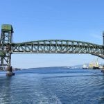 The Second Narrows Bridge in Vancouver as seen from a boat on the water after passing beneath it. Photo: Wikimedia Commons